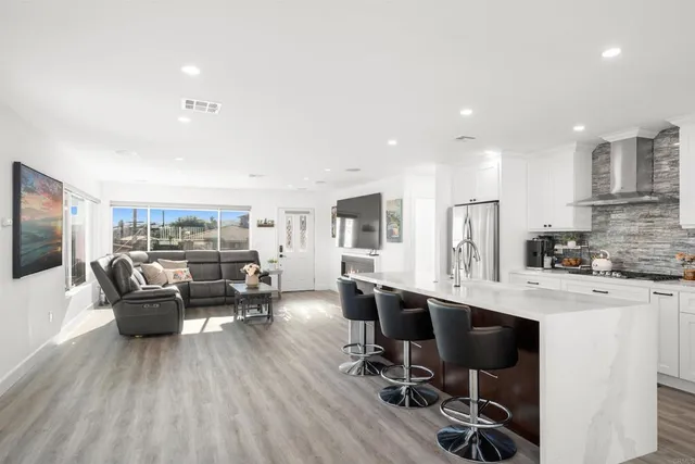 a dining room with furniture window and wooden floor