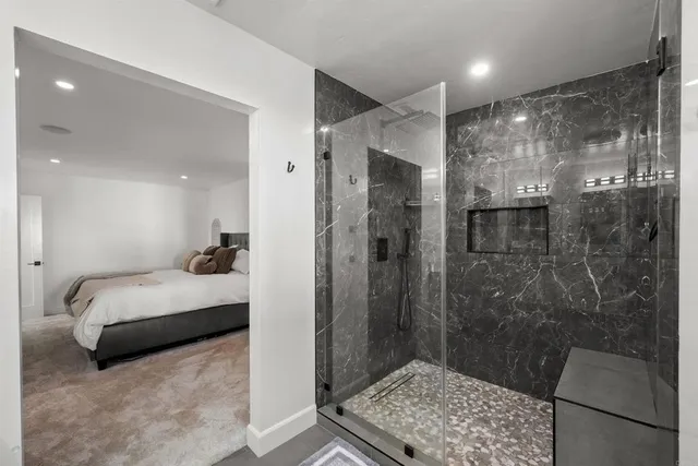 a view of a house with pool and sitting area