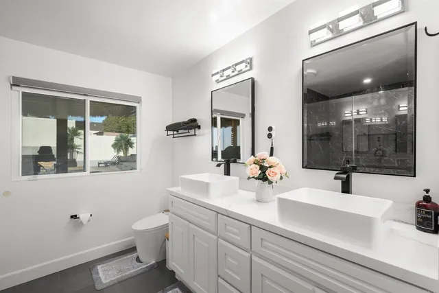 a view of a house with swimming pool and sitting area