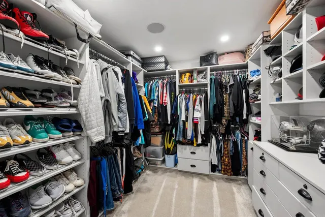 a view of a house with pool and sitting area