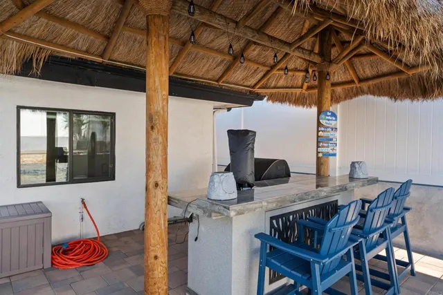 a view of an chairs and tables in the patio