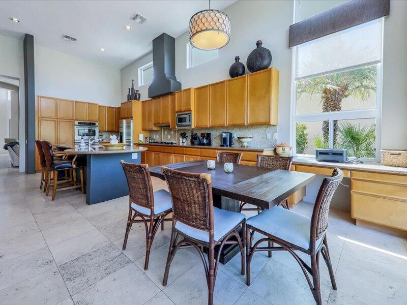 79995 Rancho La Quinta Drive La Quinta, CA 92253 - Photo 17 of 50 a dining hall with dining table and chairs