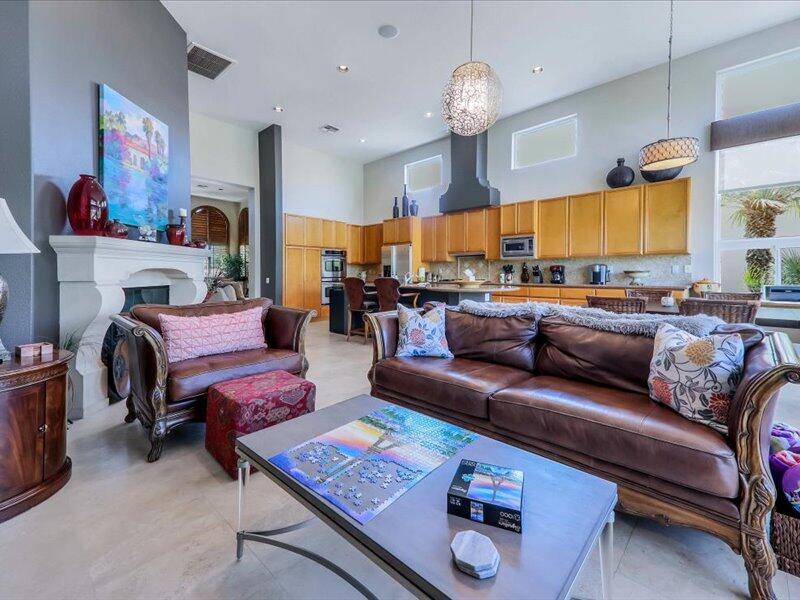 79995 Rancho La Quinta Drive La Quinta, CA 92253 - Photo 19 of 50 a living room with furniture fireplace and a large window