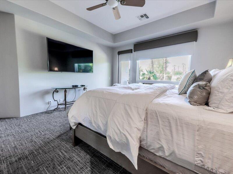 79995 Rancho La Quinta Drive La Quinta, CA 92253 - Photo 21 of 50 a bedroom with a bed and a flat screen tv