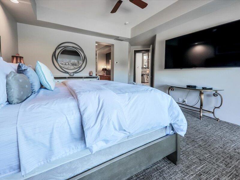 79995 Rancho La Quinta Drive La Quinta, CA 92253 - Photo 23 of 50 a bedroom with a bed and a flat tv screen on wall