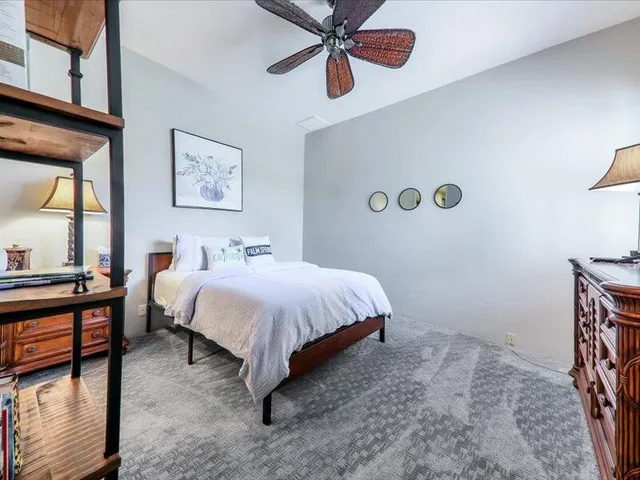 a bedroom with bed and window