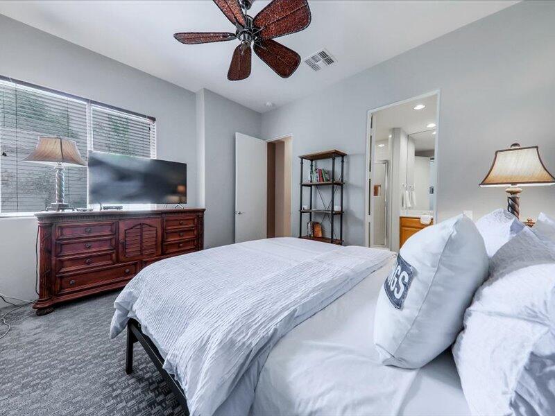 79995 Rancho La Quinta Drive La Quinta, CA 92253 - Photo 28 of 50 a bedroom with a bed and a flat screen tv