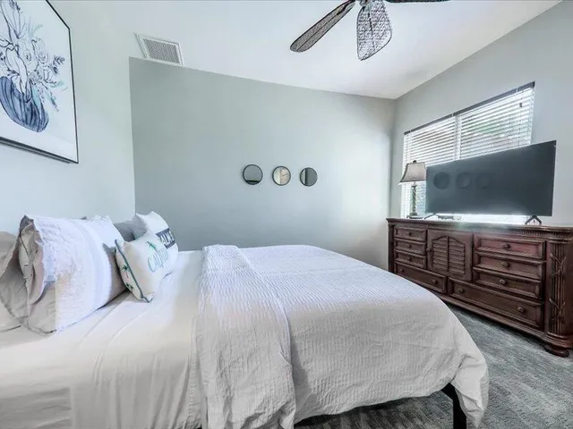 a bathroom with a double vanity sink mirror and shower