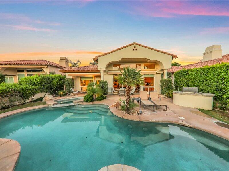 79995 Rancho La Quinta Drive La Quinta, CA 92253 - Photo 37 of 50 a front view of a house with swimming pool having outdoor seating