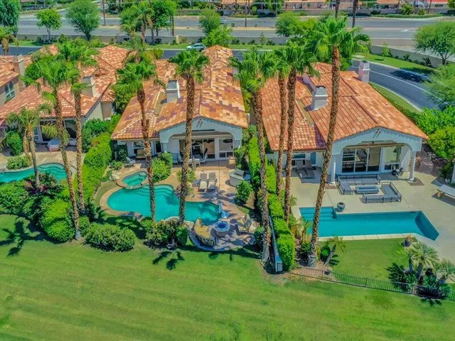 a view of a swimming pool with chairs
