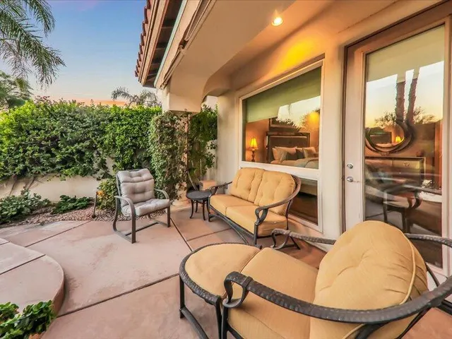 a backyard of a house with seating space
