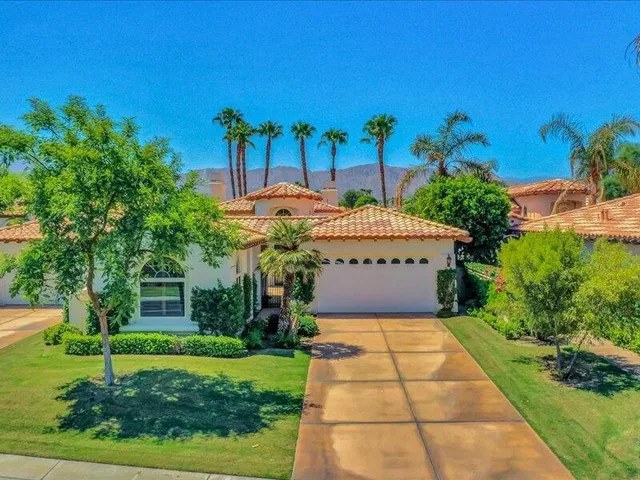 aerial view of a house with a yard