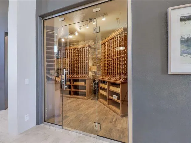 a kitchen with stainless steel appliances a sink a counter top space a refrigerator and cabinets