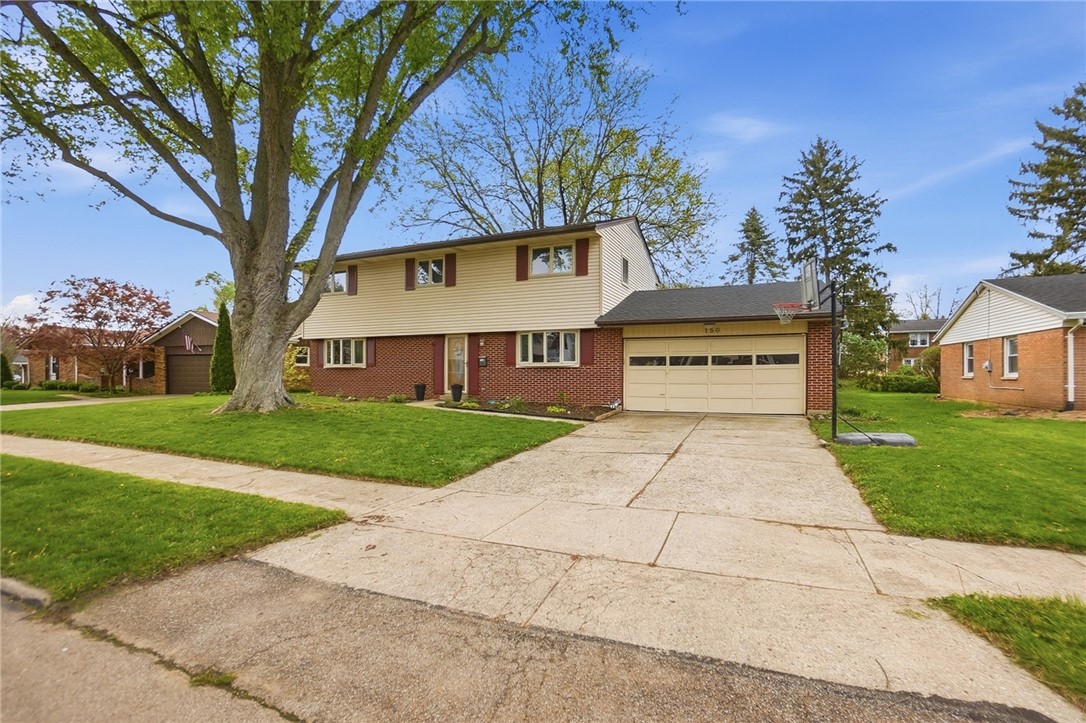 150 Littlejohn Road Troy, OH 45373 - Photo 1 of 40 This charming residence features a well-maintained exterior with a spacious driveway and attached garage.