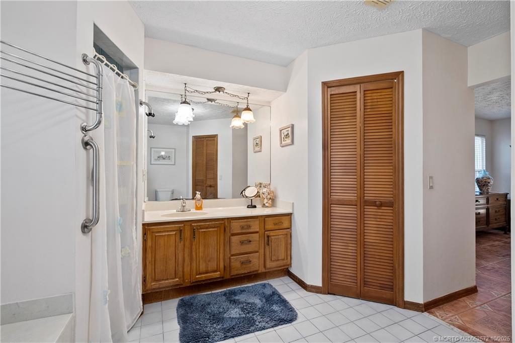 5145 Southeast Matousek Street Stuart, FL 34997 - Photo 19 of 52 a kitchen with a refrigerator and a sink