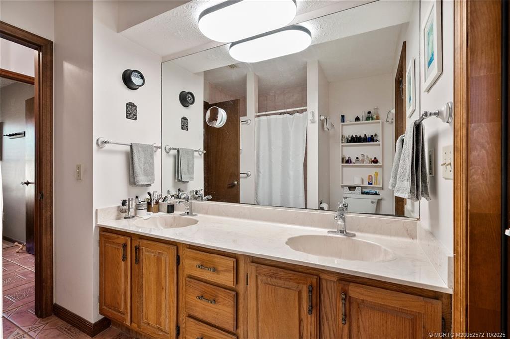 5145 Southeast Matousek Street Stuart, FL 34997 - Photo 22 of 52 a bathroom with a double vanity sink mirror and double