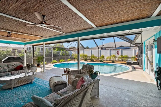 a building outdoor space with patio furniture and potted plants