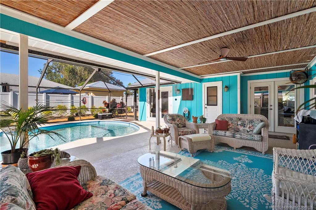 5145 Southeast Matousek Street Stuart, FL 34997 - Photo 25 of 52 a building outdoor space with patio furniture and potted plants