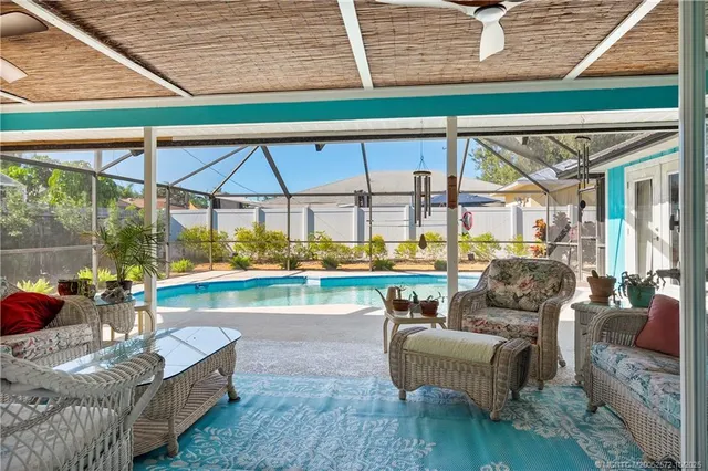 a view of a swimming pool with a patio