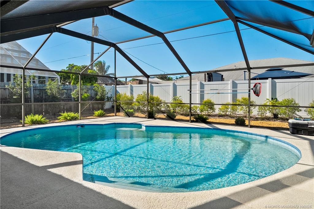5145 Southeast Matousek Street Stuart, FL 34997 - Photo 29 of 52 a view of a swimming pool with a patio