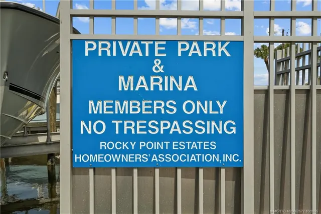 a front view of a house with a yard and lake view