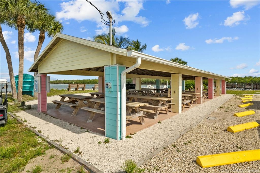 5145 Southeast Matousek Street Stuart, FL 34997 - Photo 48 of 52 a view of a house with wooden floor and outdoor space