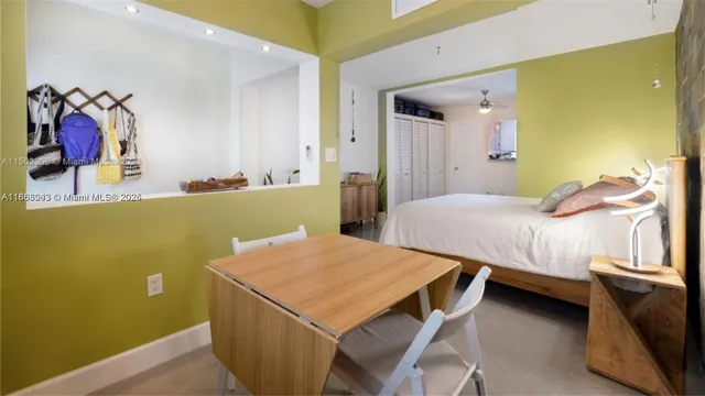 a view of a room with a table and chairs