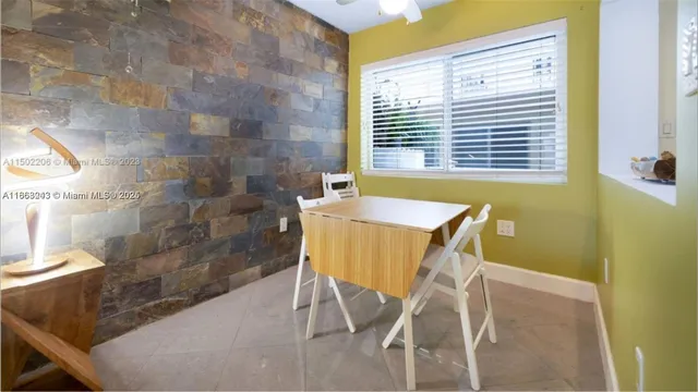 a living room with furniture and a lamp