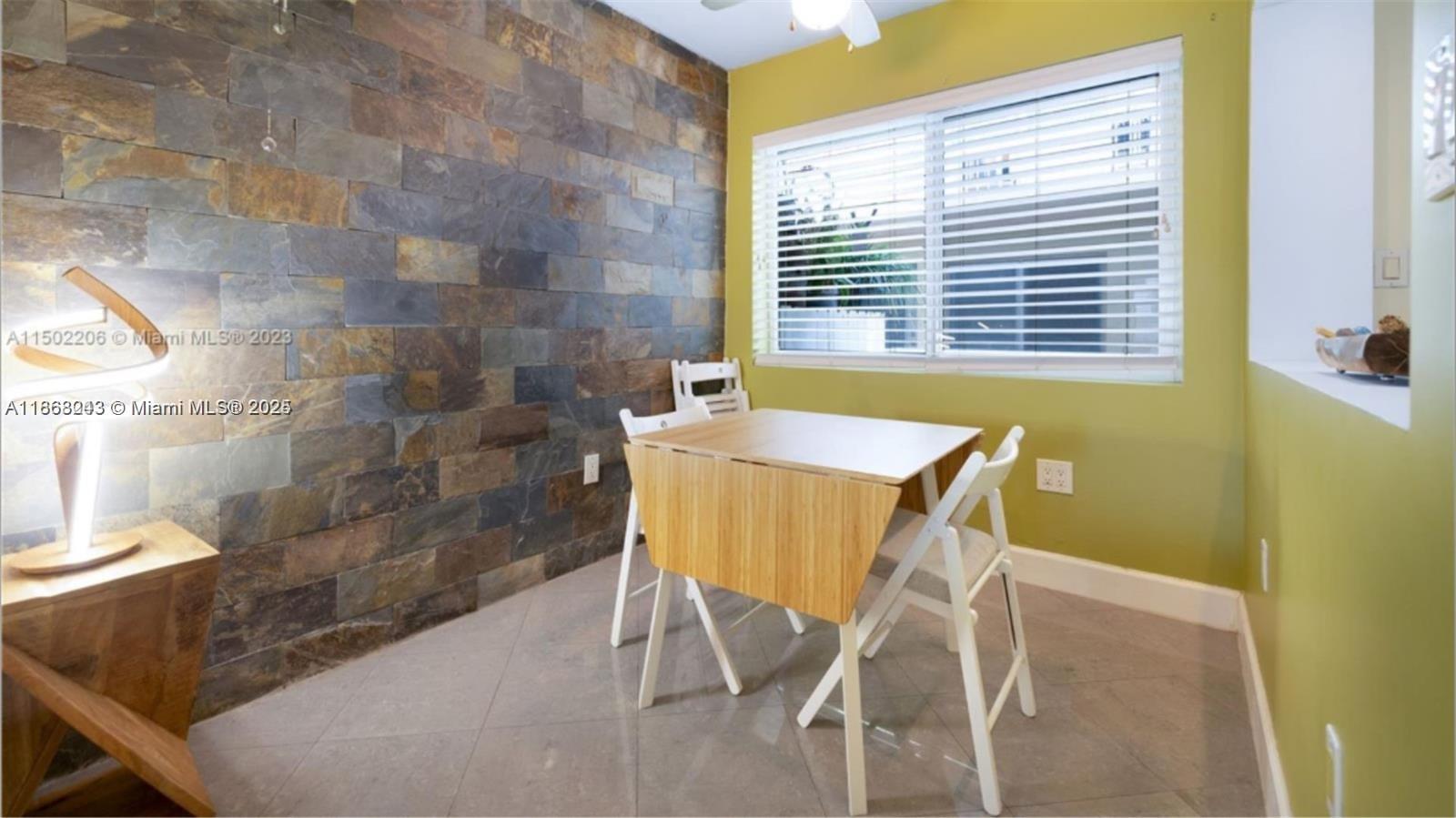 626 Meridian Avenue, Unit 5 Miami Beach, FL 33139 - Photo 13 of 19 a view of a room with a table and chairs