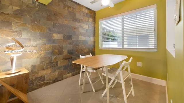 a dining room that has a table and a chair