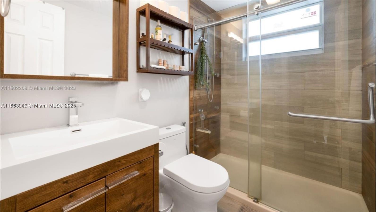 626 Meridian Avenue, Unit 5 Miami Beach, FL 33139 - Photo 7 of 19 a bathroom with a sink a toilet and shower