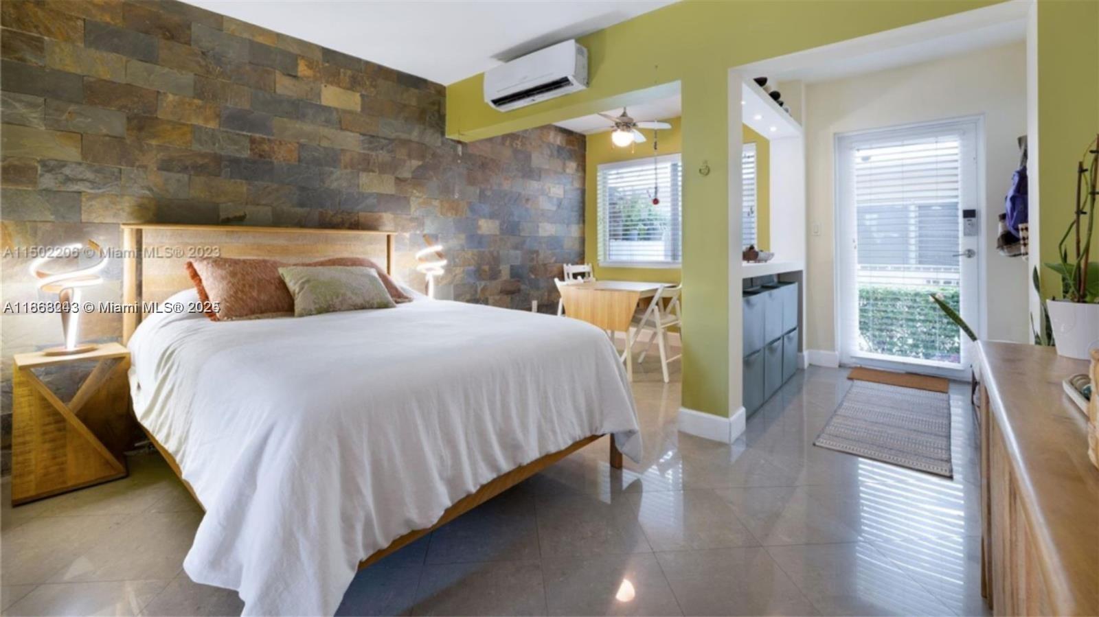 626 Meridian Avenue, Unit 5 Miami Beach, FL 33139 - Photo 9 of 19 a bedroom with a bed and wooden floor