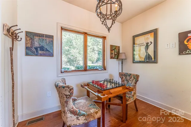 a dining room with furniture and window