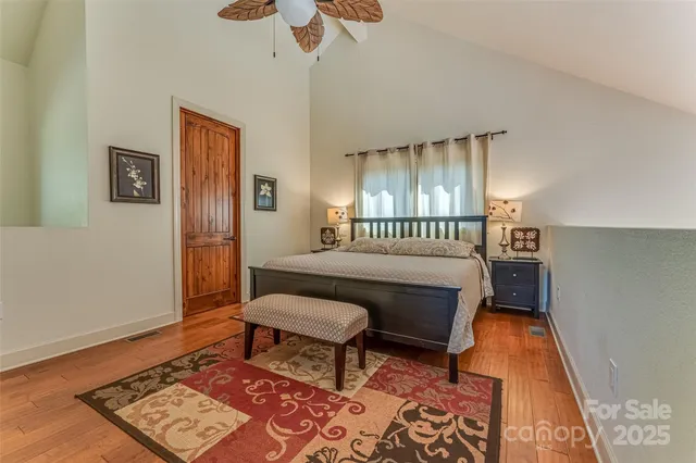 a bedroom with furniture and a rug