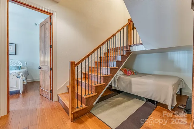 a view of entryway and hall with wooden floor