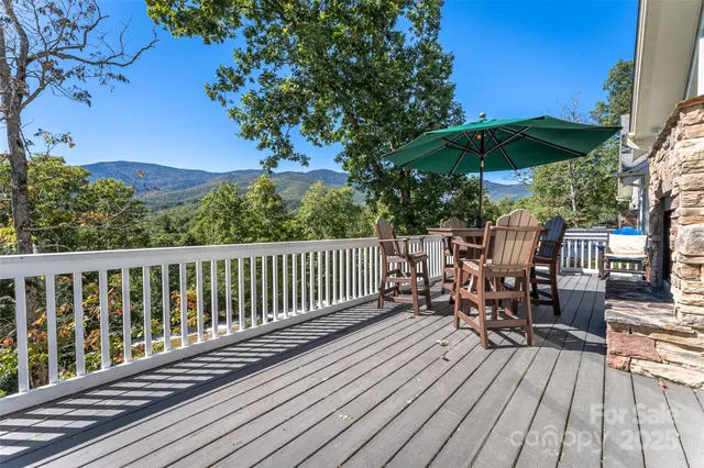 a view of balcony with outdoor seating and wooden floor