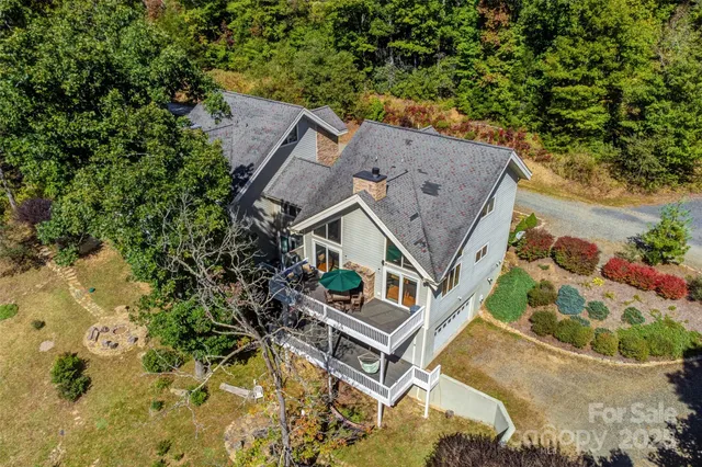 an aerial view of a house with swimming pool