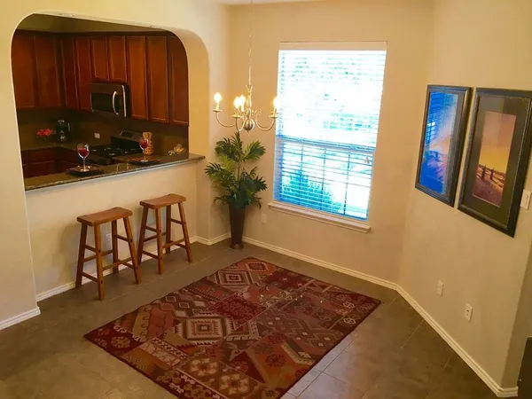 a bathroom with a sink mirror and window