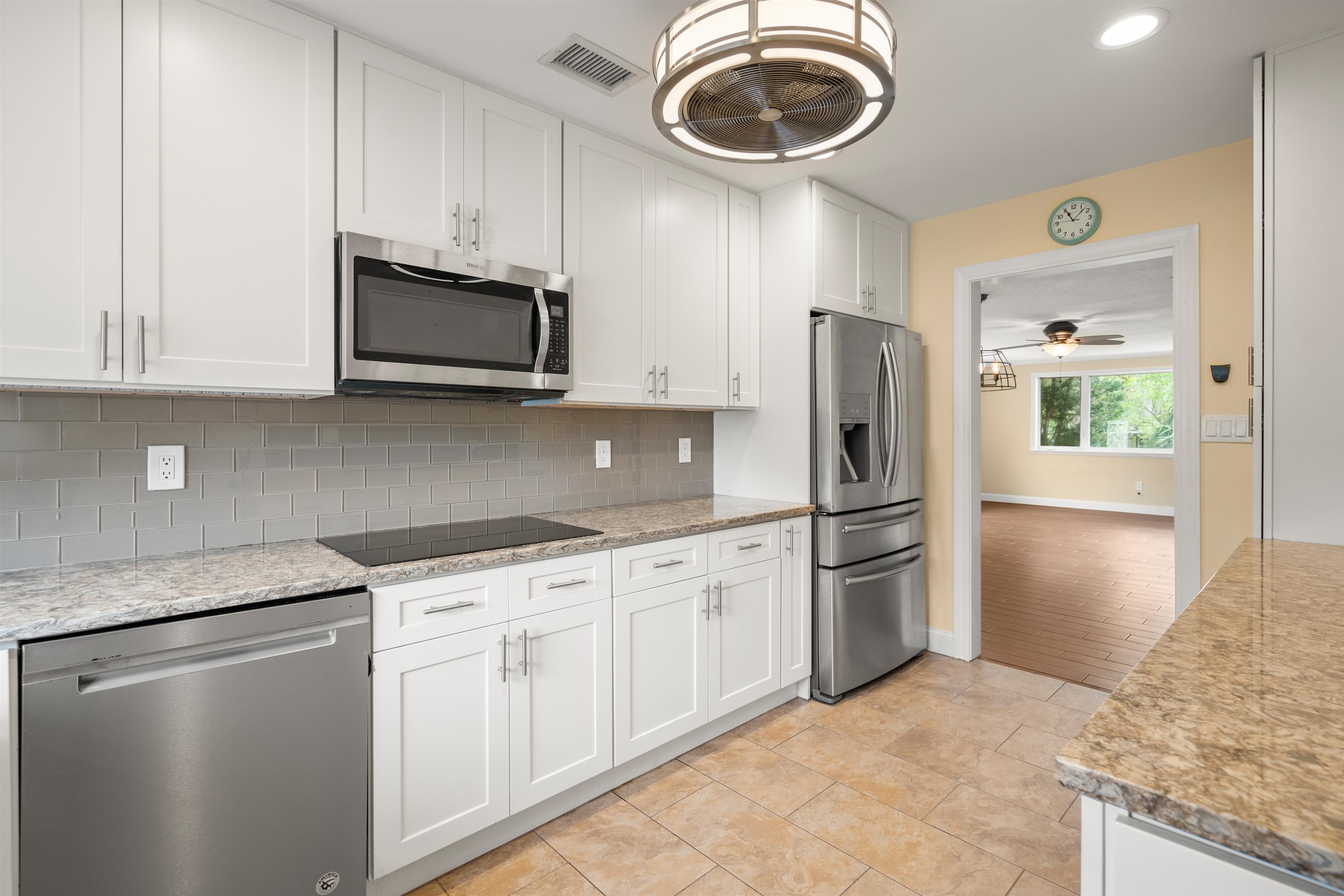 146 Menendez Road St. Augustine, FL 32080 - Photo 1 of 39 a kitchen with stainless steel appliances granite countertop a refrigerator a stove a sink and a microwave