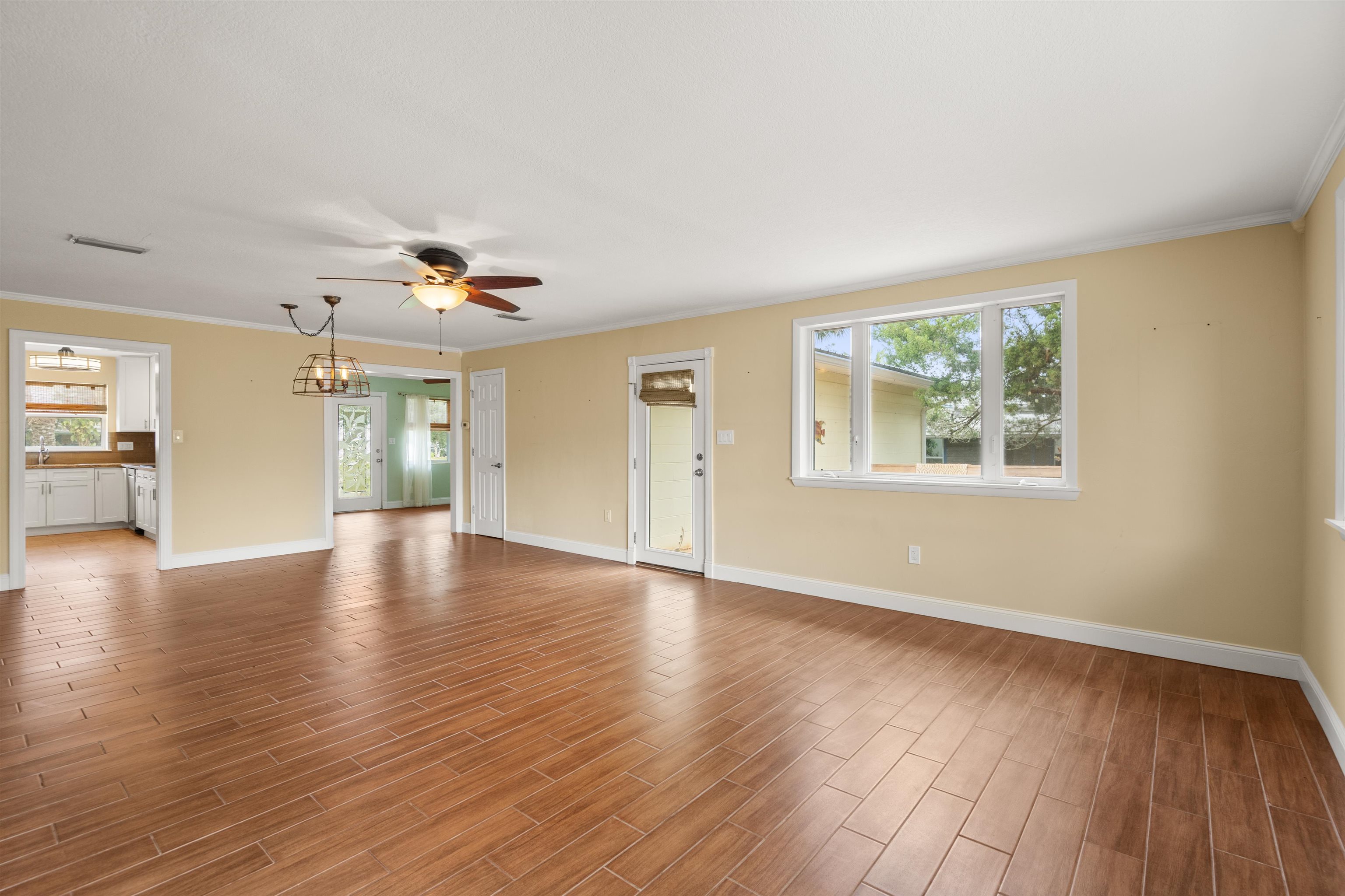 146 Menendez Road St. Augustine, FL 32080 - Photo 17 of 39 a view of an empty room with wooden floor and a window