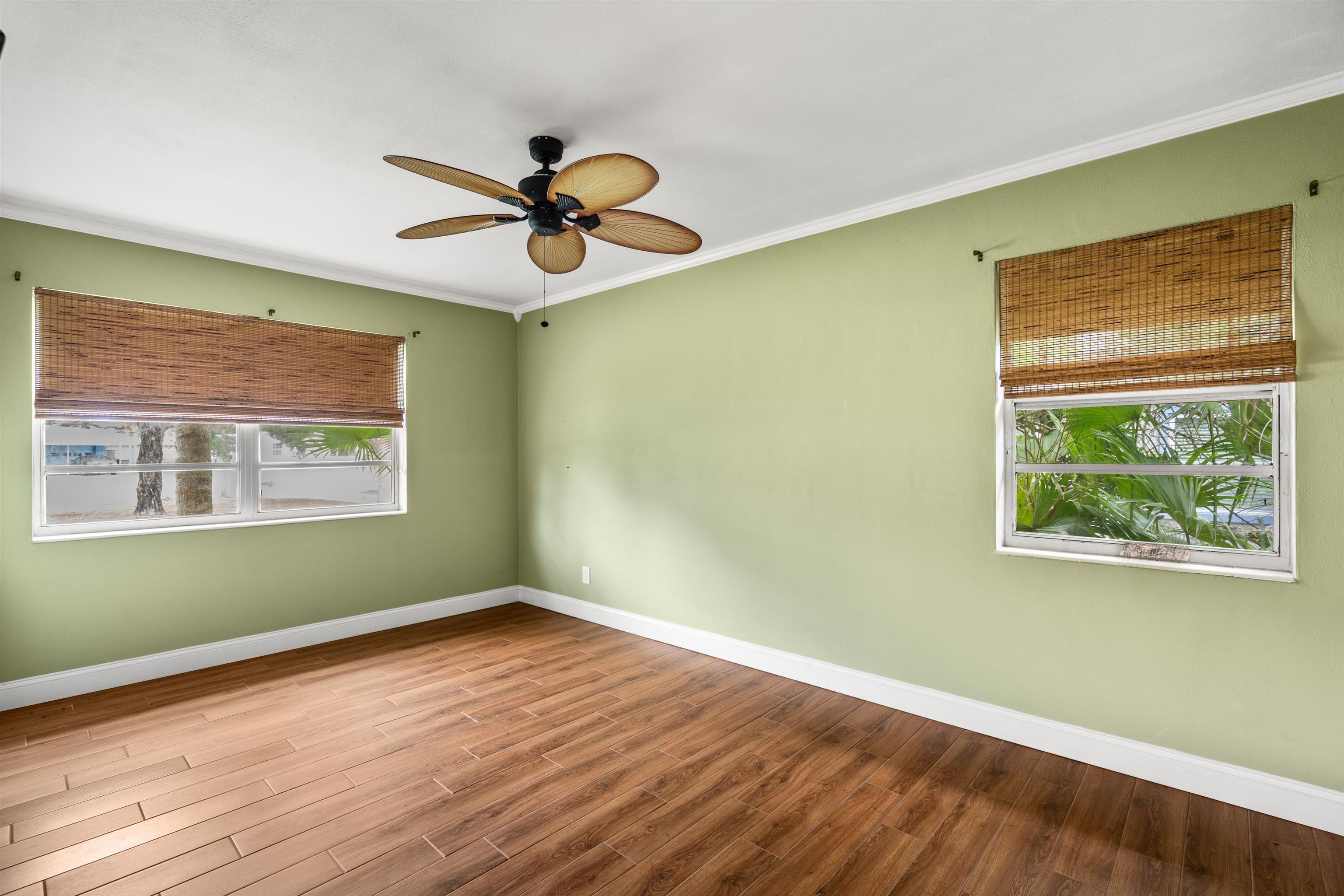146 Menendez Road St. Augustine, FL 32080 - Photo 22 of 39 a view of an empty room with wooden floor and a window