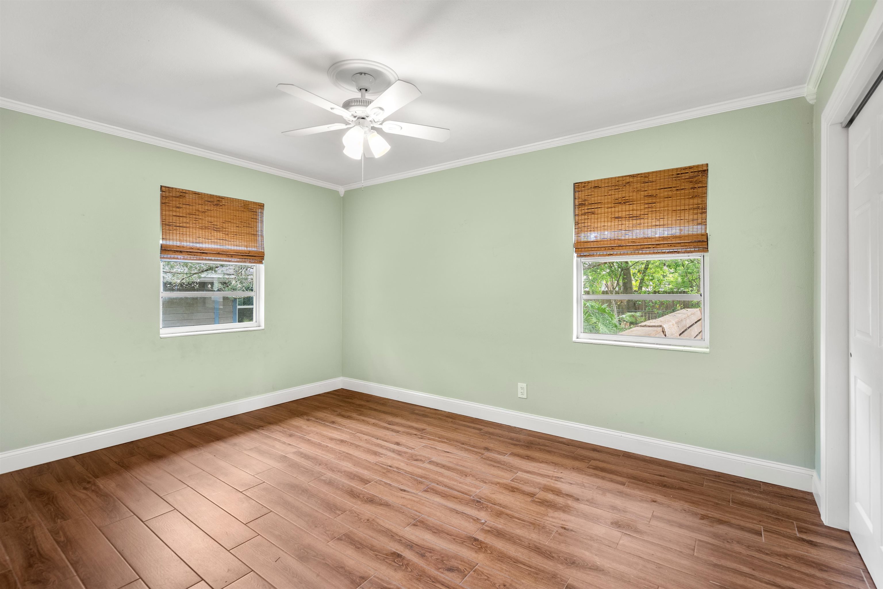 146 Menendez Road St. Augustine, FL 32080 - Photo 24 of 39 a view of an empty room with wooden floor and a window