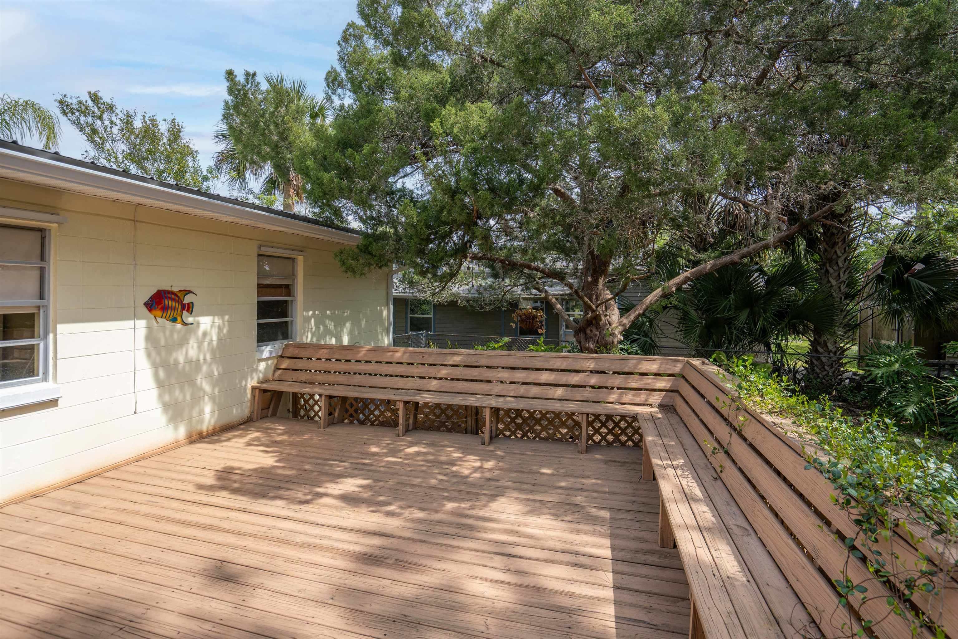 146 Menendez Road St. Augustine, FL 32080 - Photo 6 of 39 a view of a roof deck with wooden floor and fence