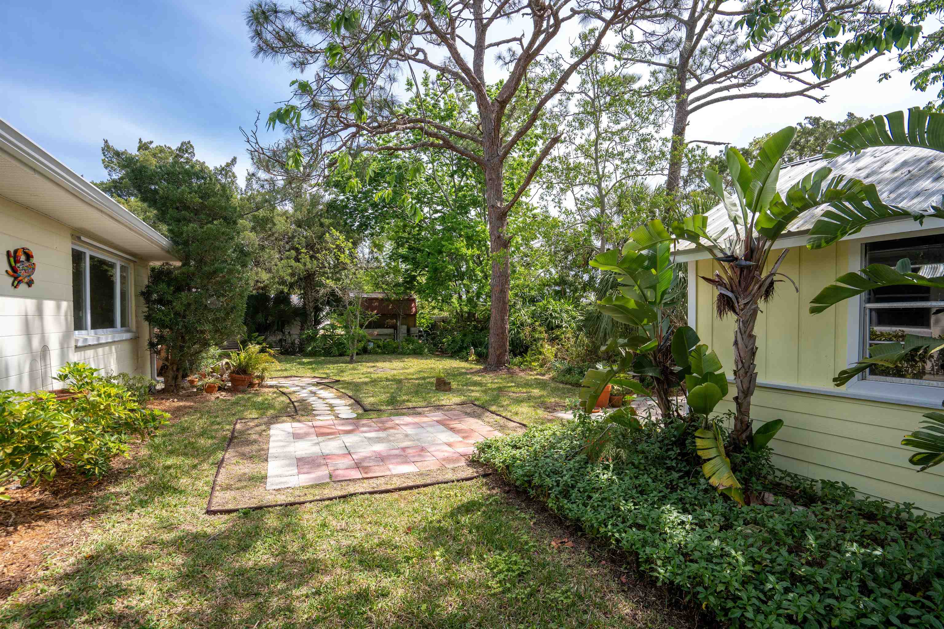 146 Menendez Road St. Augustine, FL 32080 - Photo 9 of 39 a view of a backyard with a fountain