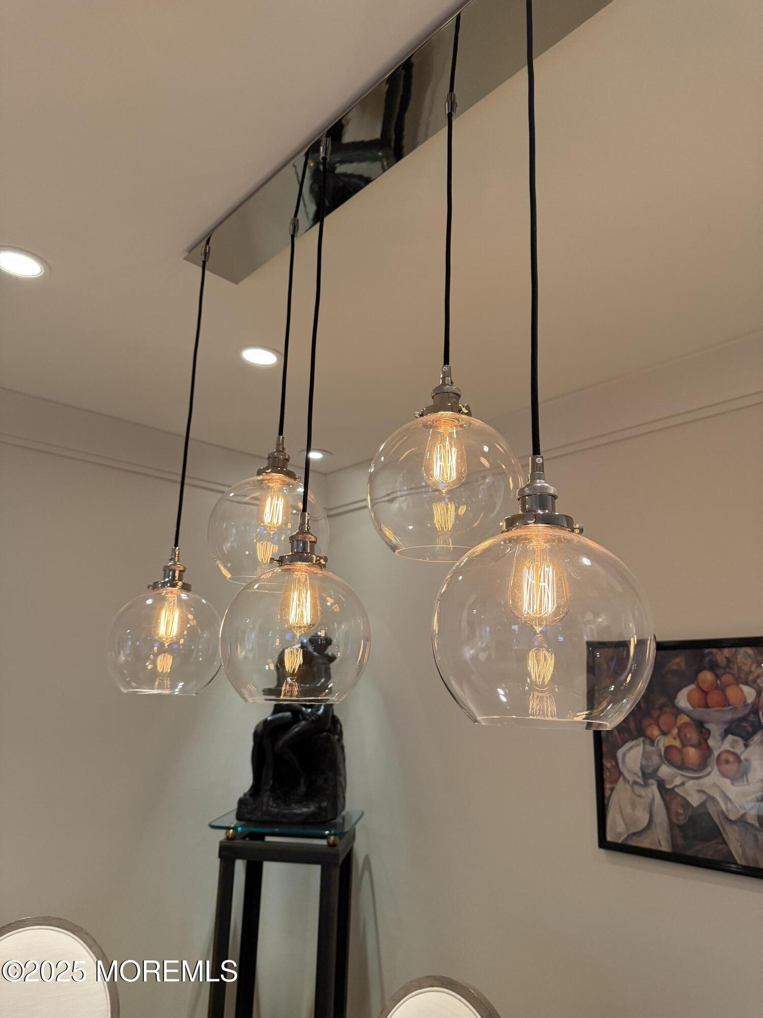 23 Locust Way Spring Lake Heights, NJ 07762 - Photo 11 of 57 a view of a chandelier fan and kitchen view