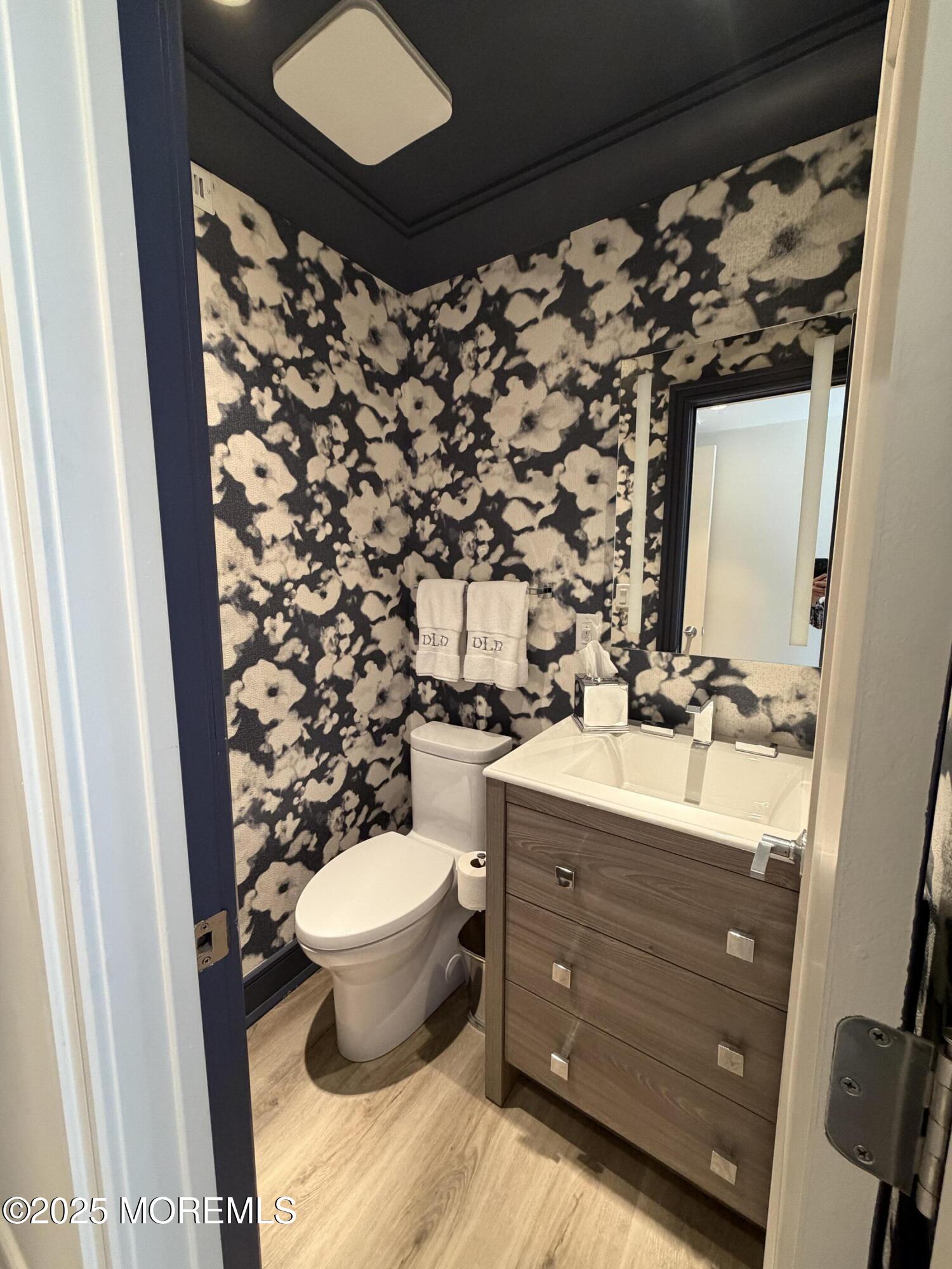 23 Locust Way Spring Lake Heights, NJ 07762 - Photo 19 of 57 a bathroom with a toilet sink and mirror