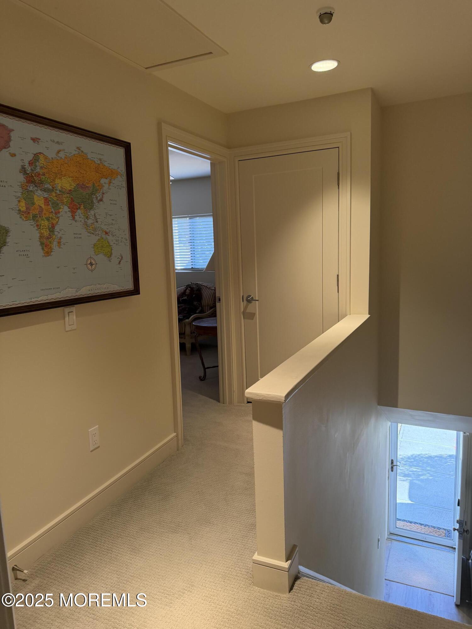 23 Locust Way Spring Lake Heights, NJ 07762 - Photo 28 of 57 a view of a hallway with paintings on the wall