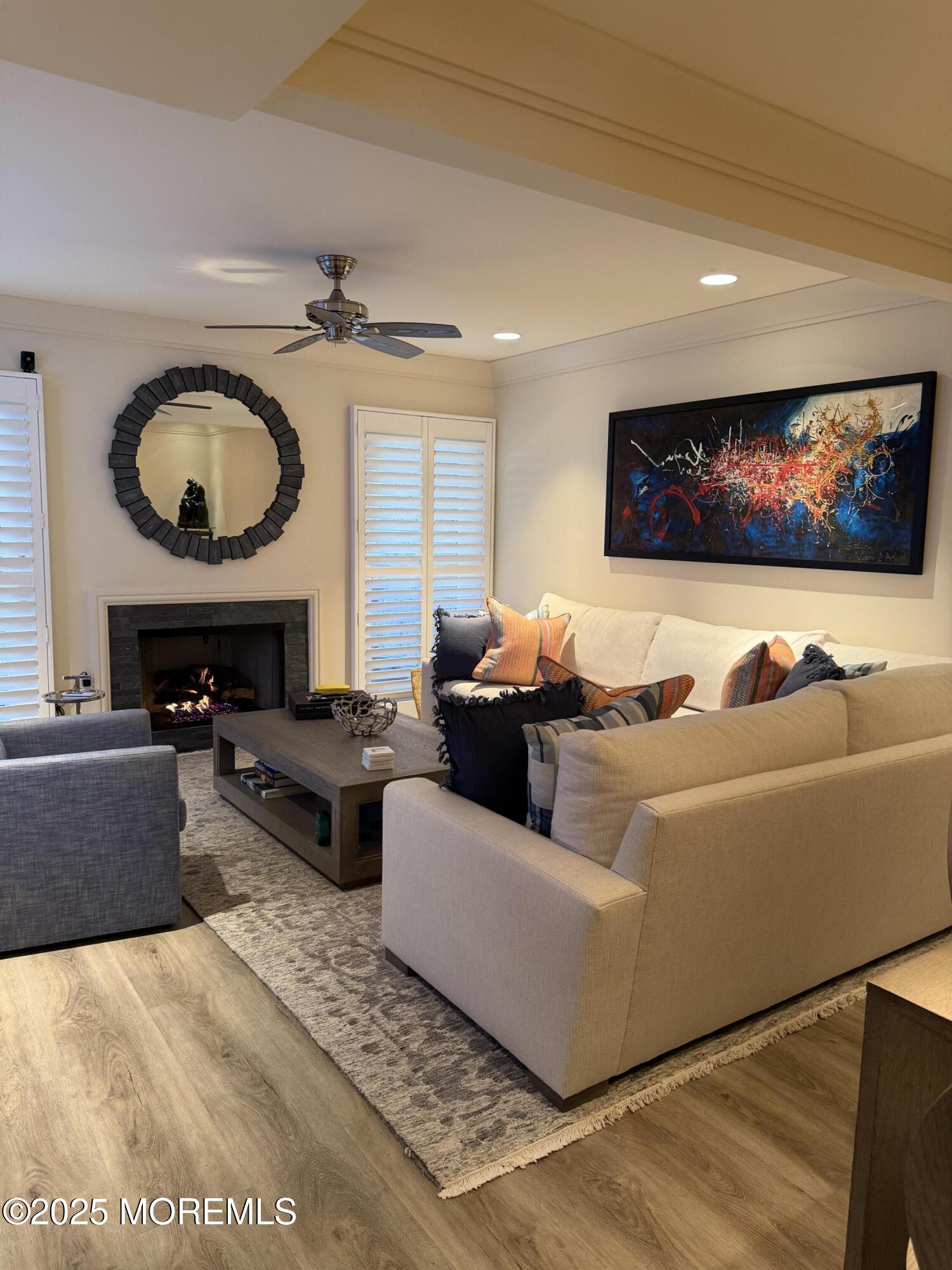 23 Locust Way Spring Lake Heights, NJ 07762 - Photo 4 of 57 a living room with furniture a rug and a fireplace