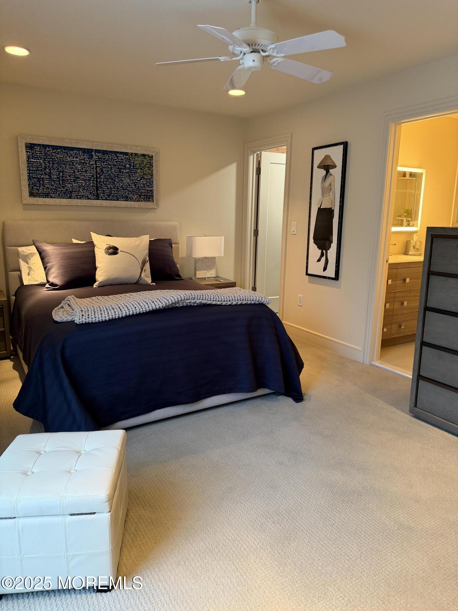 23 Locust Way Spring Lake Heights, NJ 07762 - Photo 45 of 57 a spacious bedroom with a bed a painting on the wall and a window