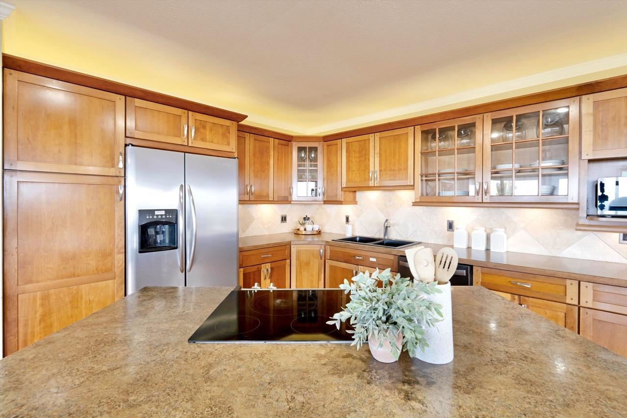 1115 Pookela Road Makawao, HI 96768 - Photo 15 of 37 a kitchen with a refrigerator and a potted plant